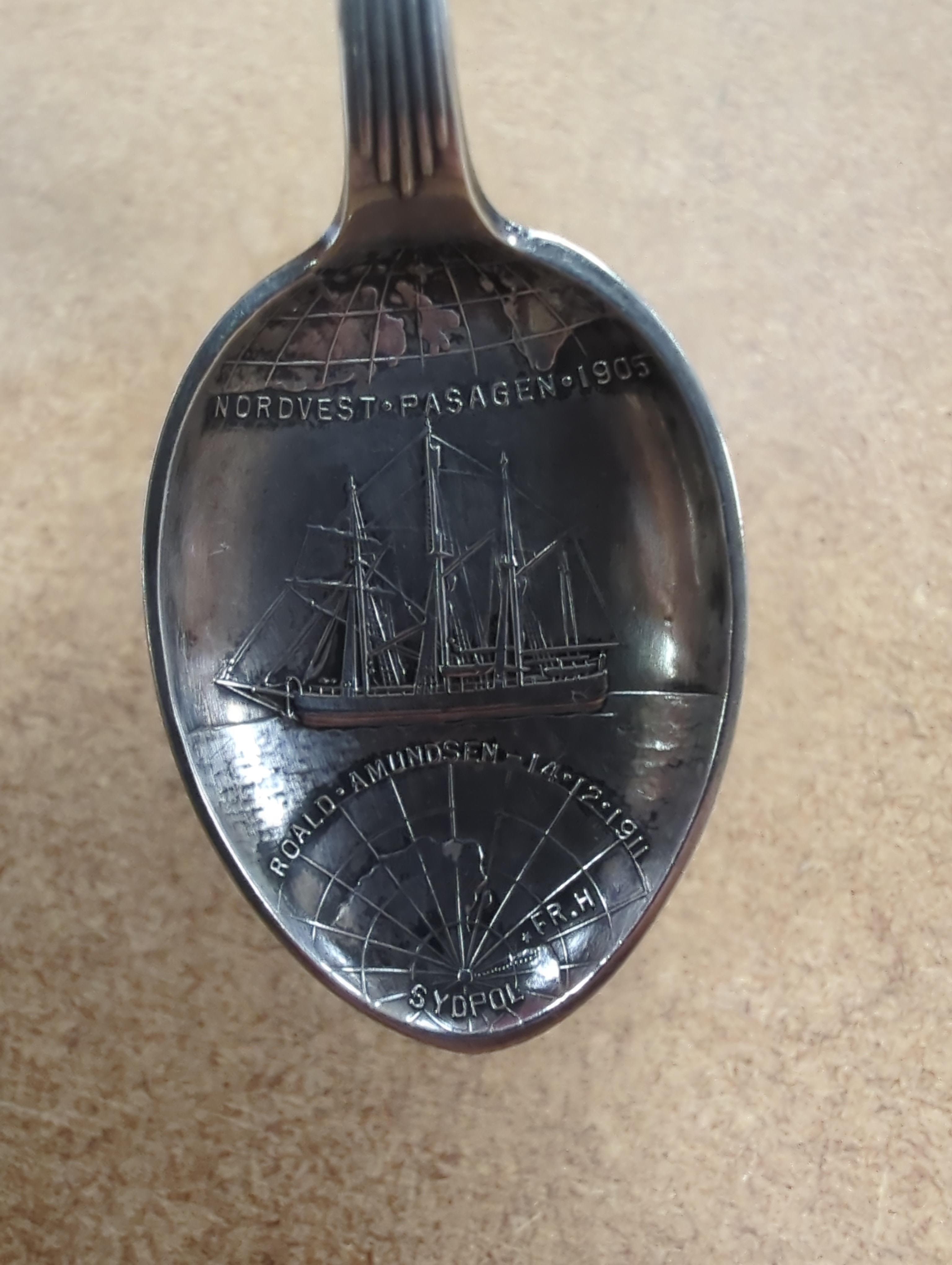 A Roald Amundsen commemorative .830 silver spoon, circa 1911, and five other commemorative spoons, of which four are silver including; Royal Military College, Small Arms School, Royal Army Service Corps, The Kensingtons